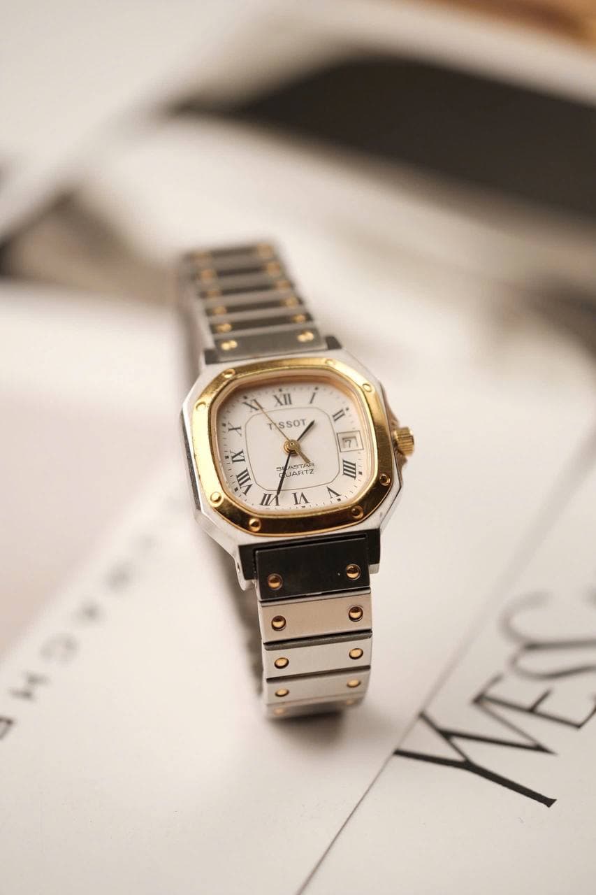 Gold watch with a Roman numeral dial