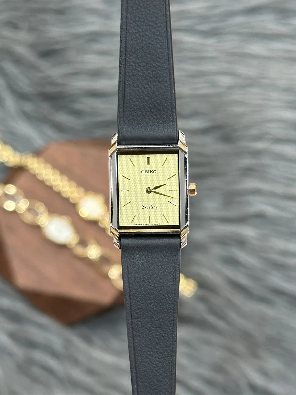Seiko Exceline 1990s tank champagne textured dial two-tone case black leather strap